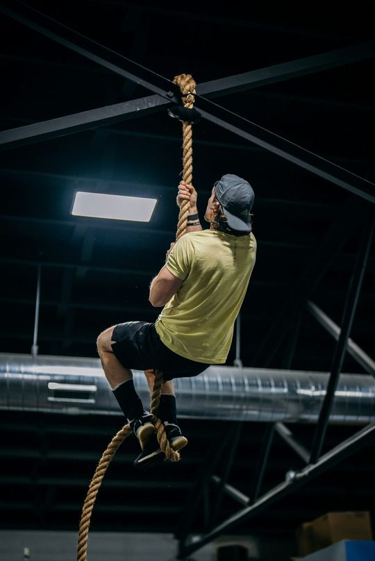 Pull-ups in a dark gym